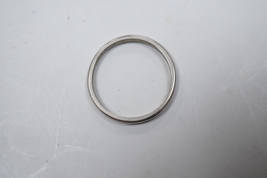 An engraved platinum wedding ring, size P1/2, gross weight approximately 3 grams, Condition: some wear to engraving